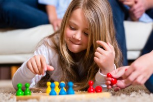 Family playing board game at home