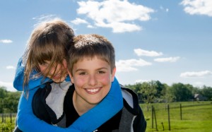 iStock_000012913016Small sister on boys shoulder